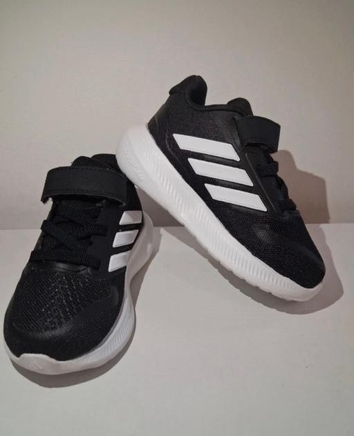  — Adidas black kids sneakers