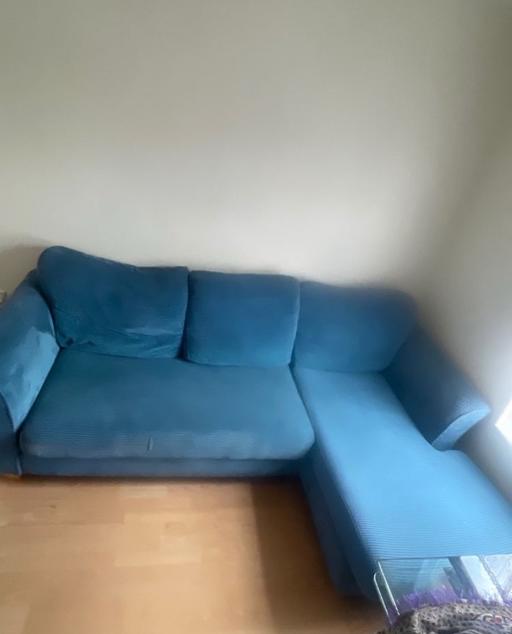  — Blue L shape sofa