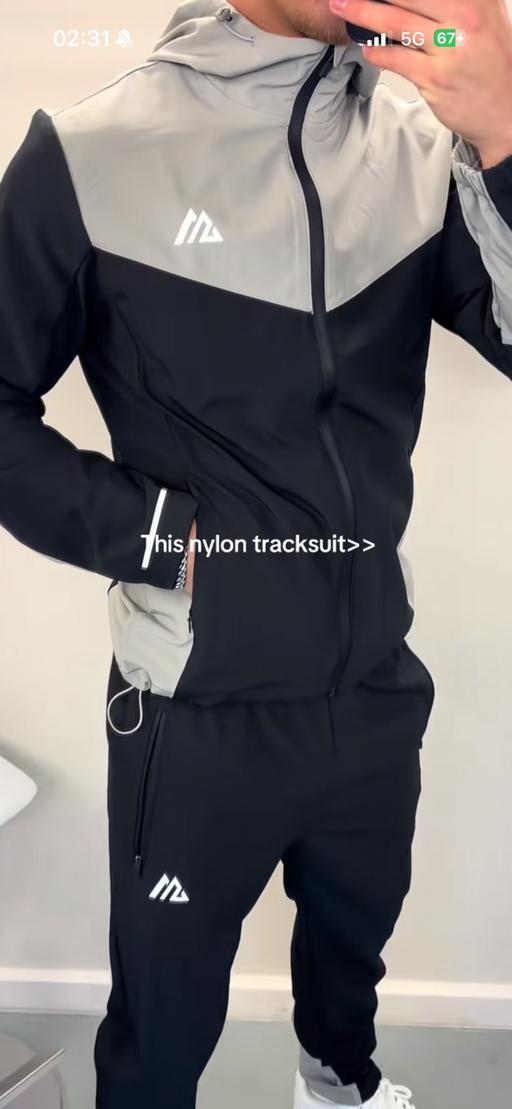  — Tracksuit