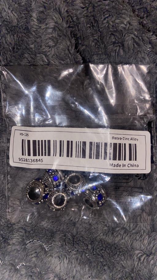  — New charms