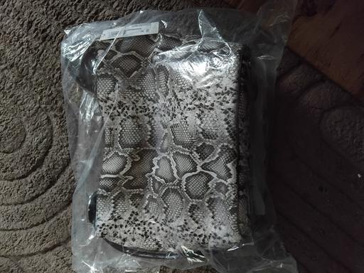  — m&s snake print hand bag