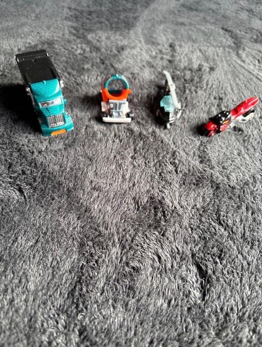  — Four hot wheels cars