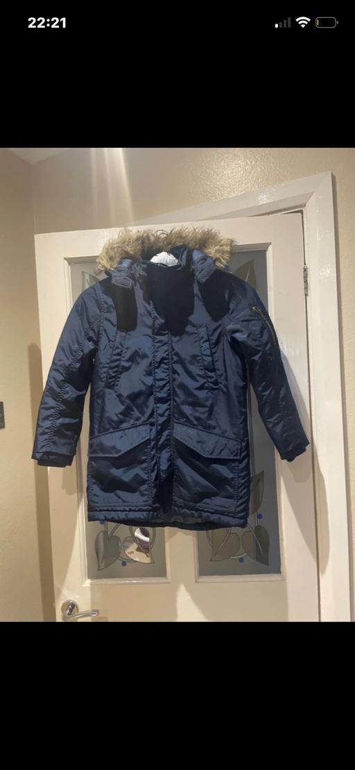  — Blue parka coat