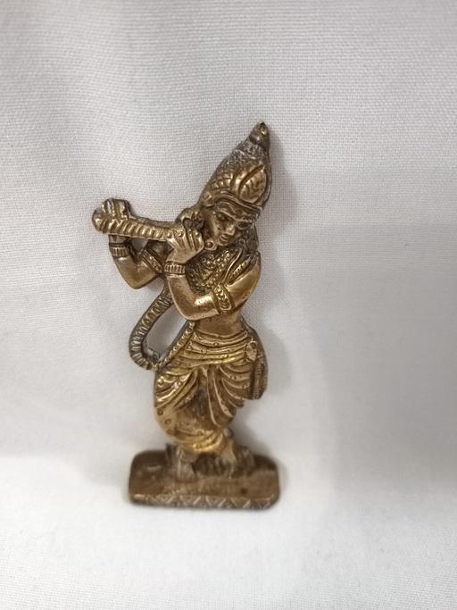  — VINTAGE SMALL BRASS LORD KRISHNA FIGURE.