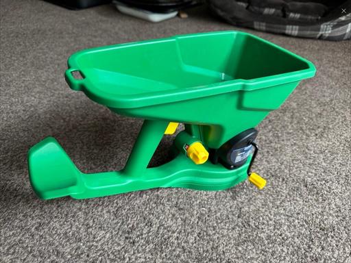  — Brand New Handheld Spreader