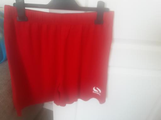  — Size M red elasticated waist shorts