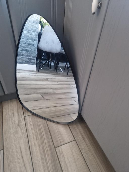  — Large black metal unusual shape mirror