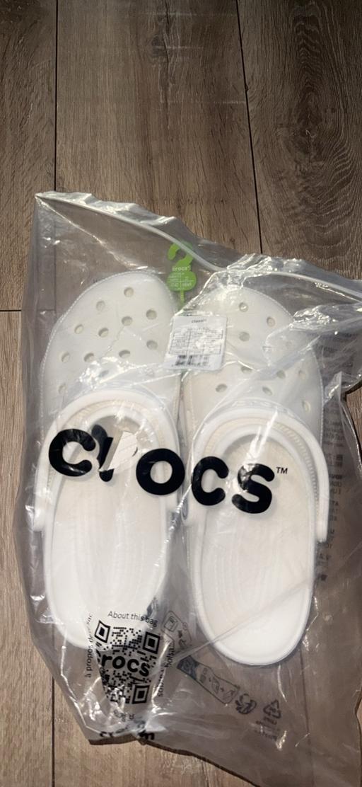  — Crocs
