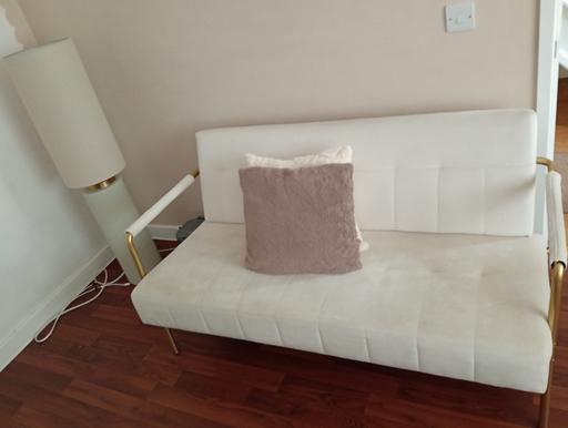  — cream and gold sofa