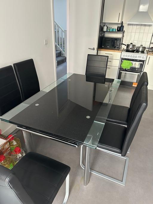  — Glass dining table and chairs