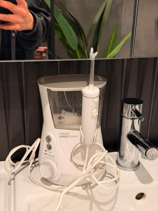  — Water flosser waterpik