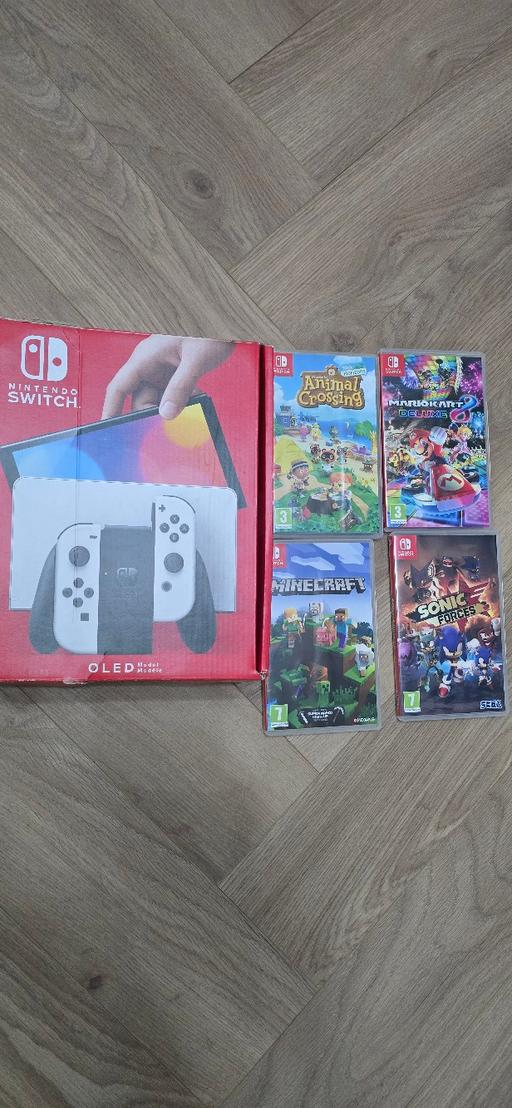 — Nintendo Switch OLED bundle with game