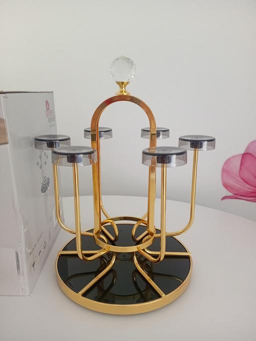  — Rotatable glass holder rack