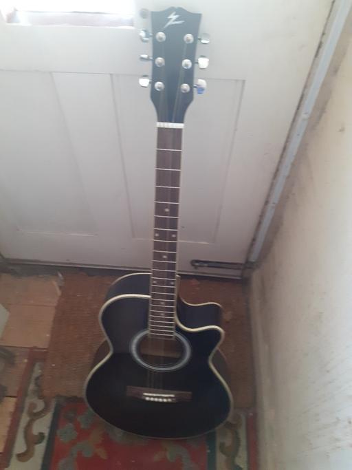  — GUITAR