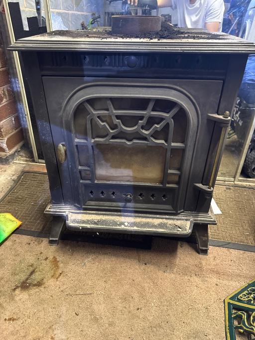  — Iron log burner stove