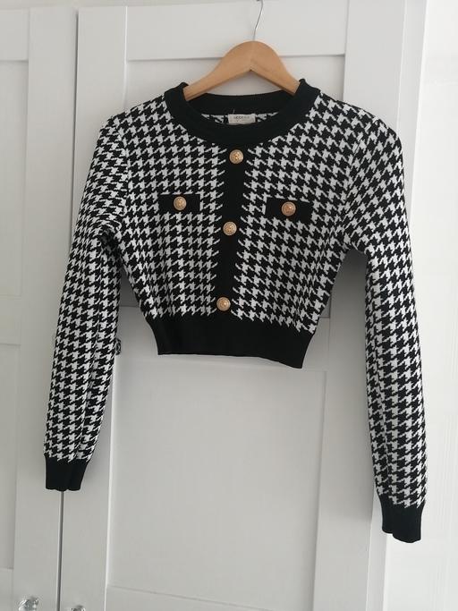  — women's size 10-12 black and white cardigan