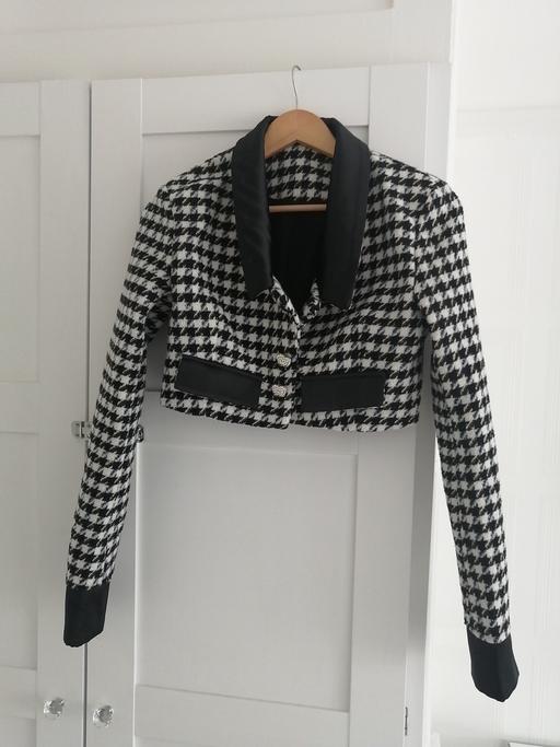  — women's size small black and white jacket
