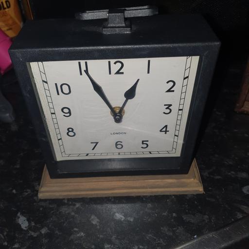  — 7 x 7 inch Black Metal Clock On Wooden Mount,
