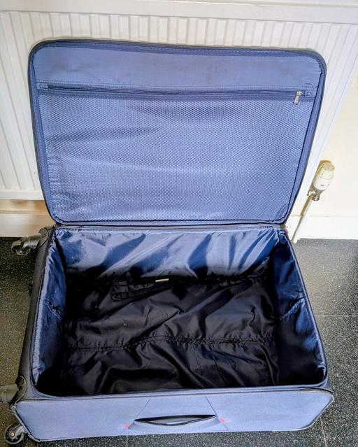  — SUITCASE