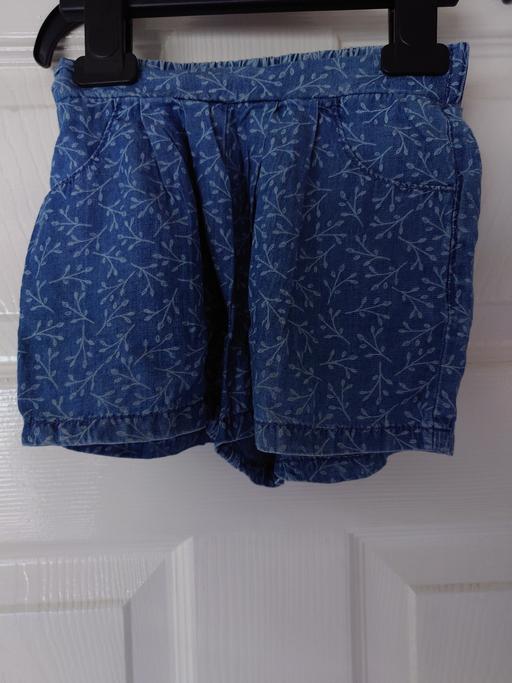  — Girls blue shorts size 12-18 months