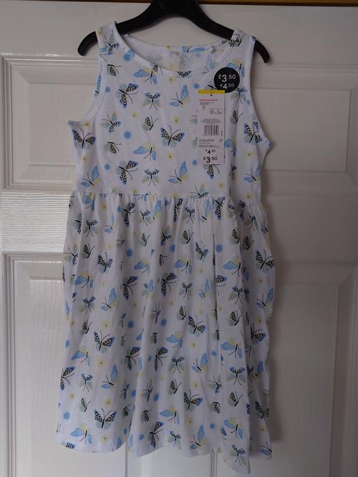  — Girls white butterfly dress size 7-8 years