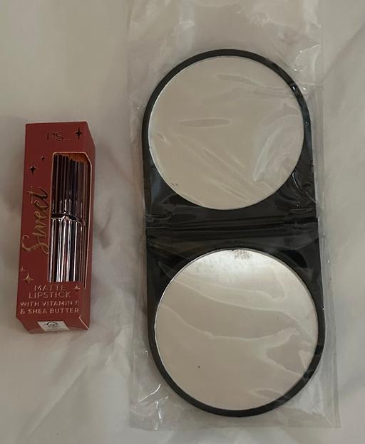  — Lipstick and folding handbag mirror