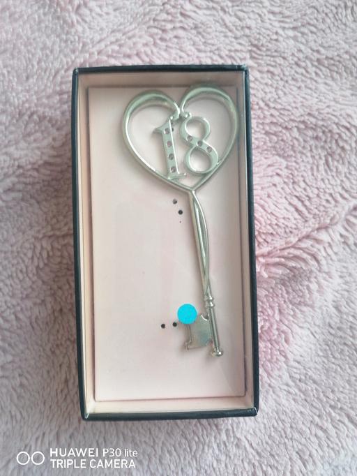  — "18" key gift