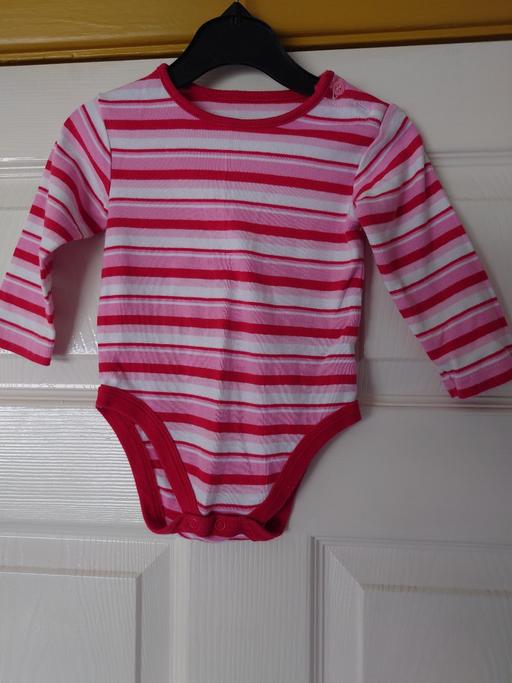  — Baby girls stripey vest size 6-9 months