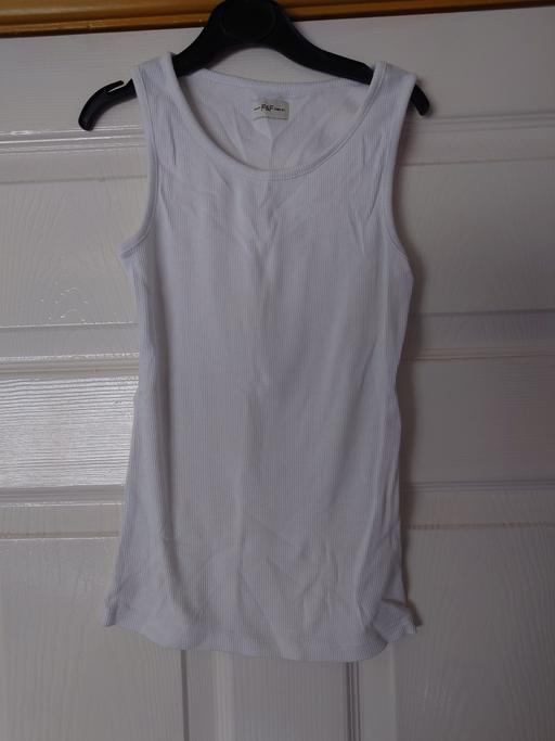  — Girls white vest top size 8-9 years