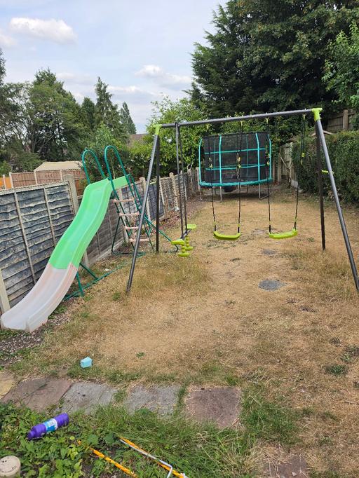  — trampoline, slide and swing set