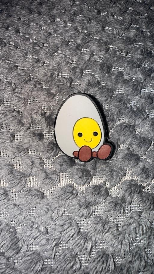  — Egg inspired croc charm