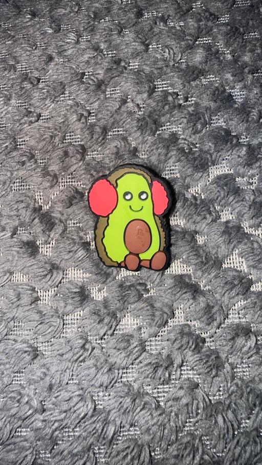  — Avocado with ear muffs croc charm