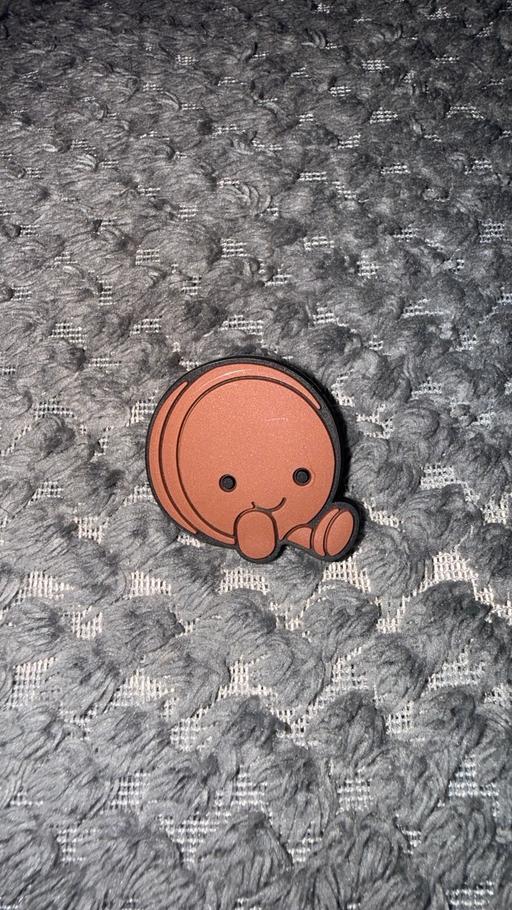  — Brown macaron croc charm