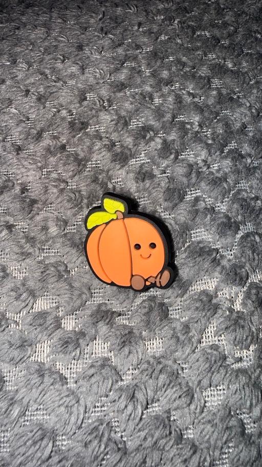  — Peach croc charm