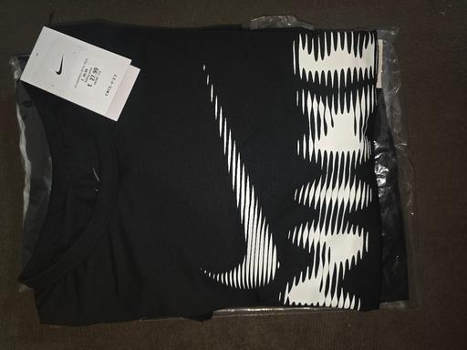  — black nike T