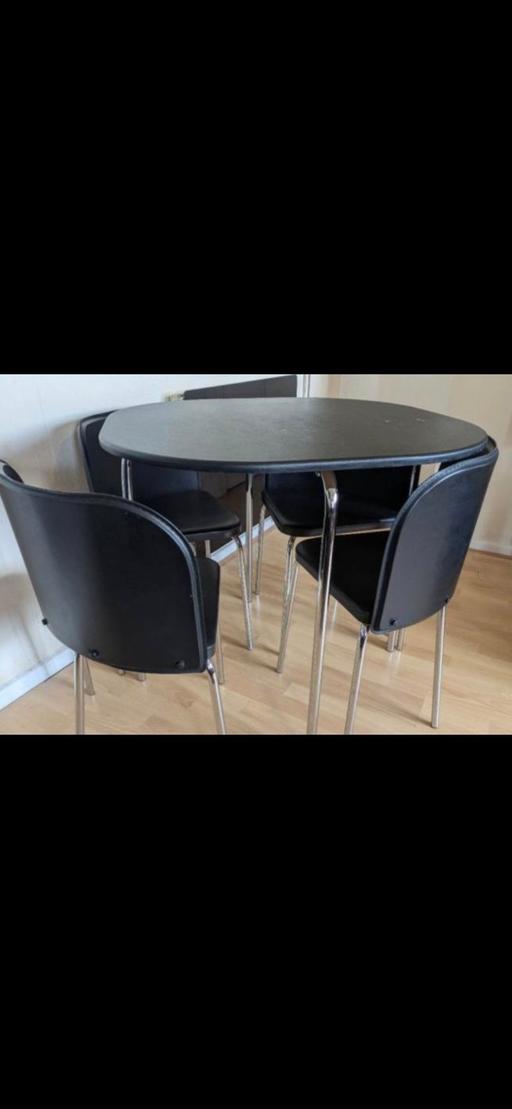  — Black dining table with 4 chairs