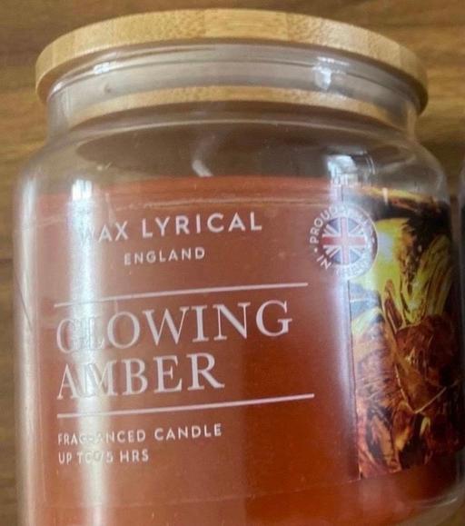  — Glowing amber candle