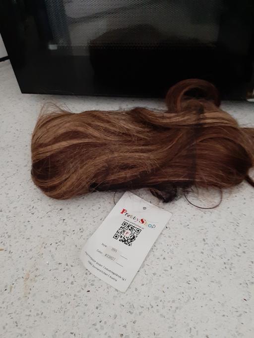  — new hairpiece slide