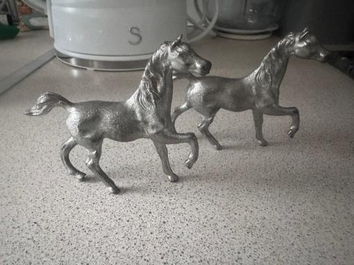  — 2x small pewter horses.