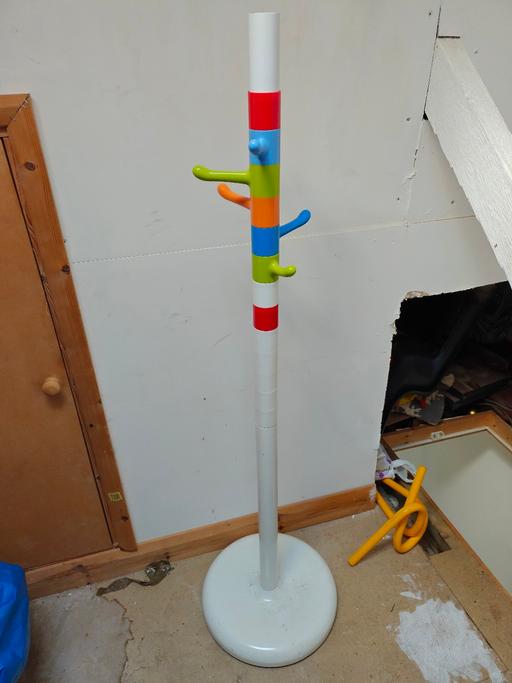  — Multicoloured coat rack with multiple hooks.