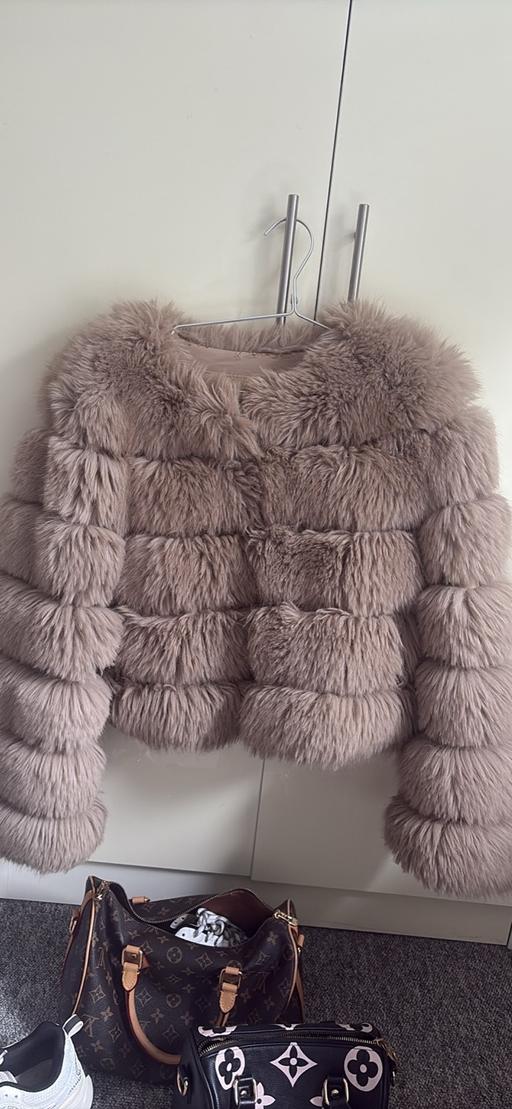  — Women’s fur coat