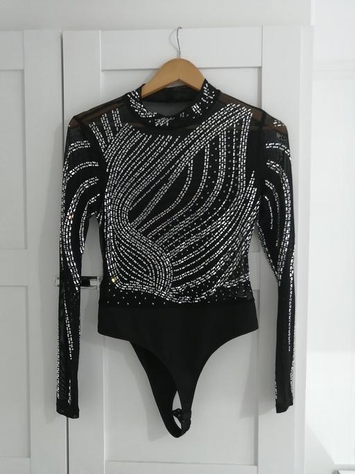  — women's size 10-12 black evening top
