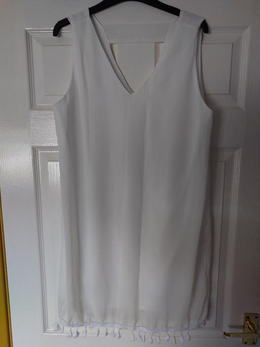  — Women's white sleeveless top size XL