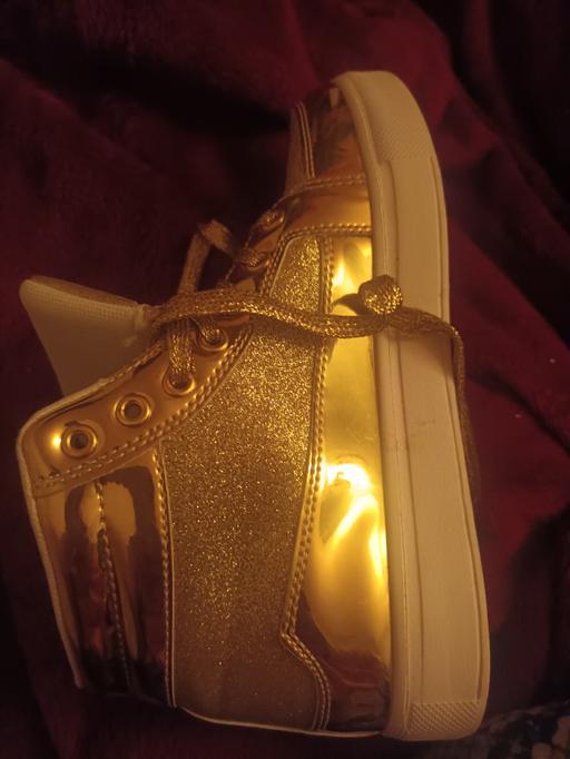  — Gold and white shoes