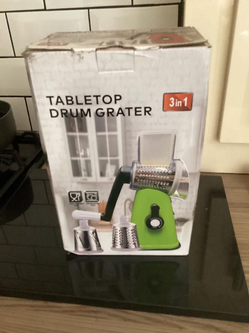 — New in box table top grater