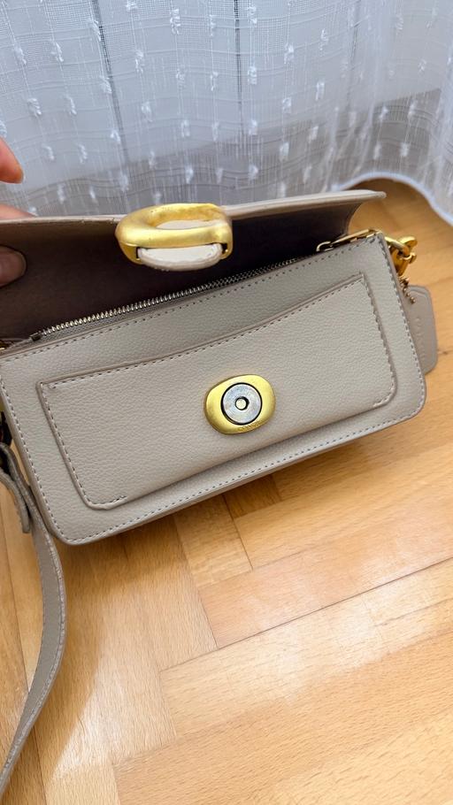  — Beige cross body