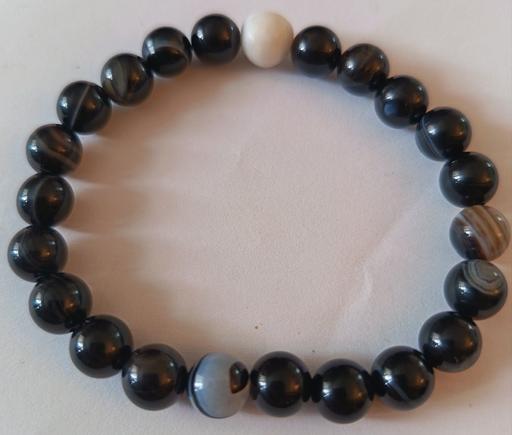  — Black banded agate with one white bead