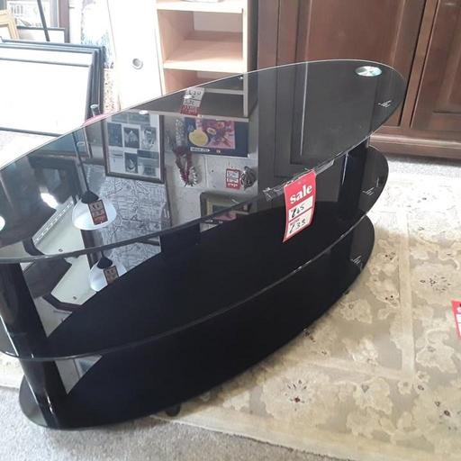  — Oval black glass tiered TV stand