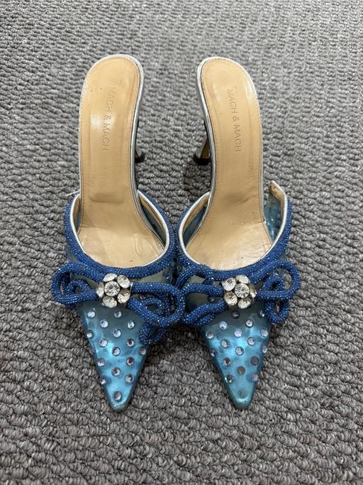 — Mach and Mach blue heels