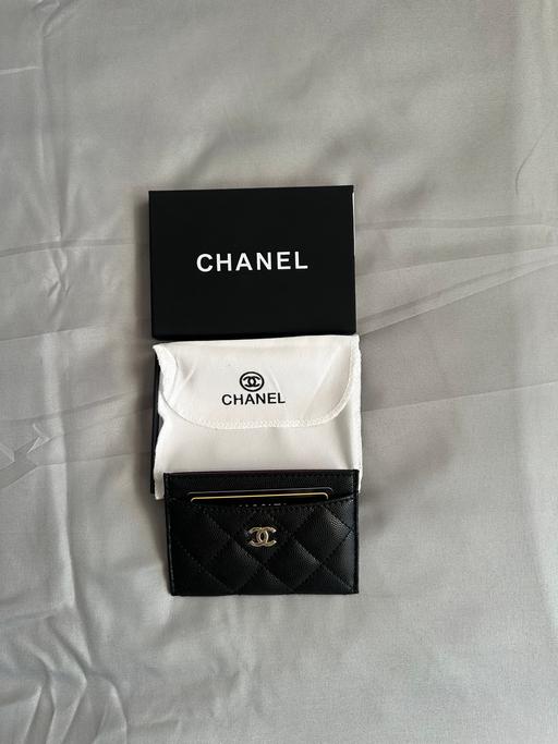  — Black quilted Chanel card holder